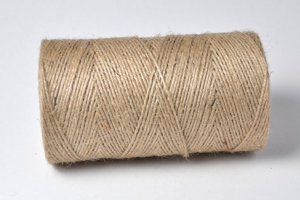 natural coloured un dyed spool of jute twine navy blue braid